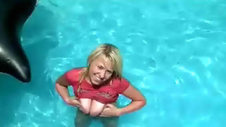 Big titted girl in a pool